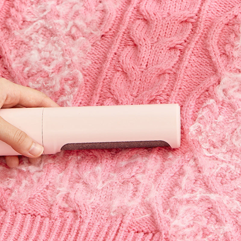 Brushing clothe with the 2 in 1 Reusable Pet Hair Remover Brush Lint Roller
