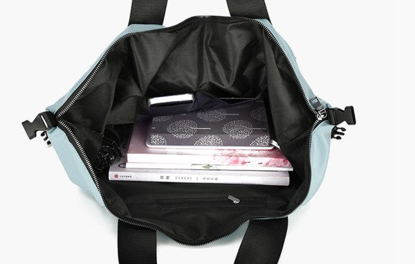 This is a view of the inside of the tote backpack. It shows the interior compartments and pockets.