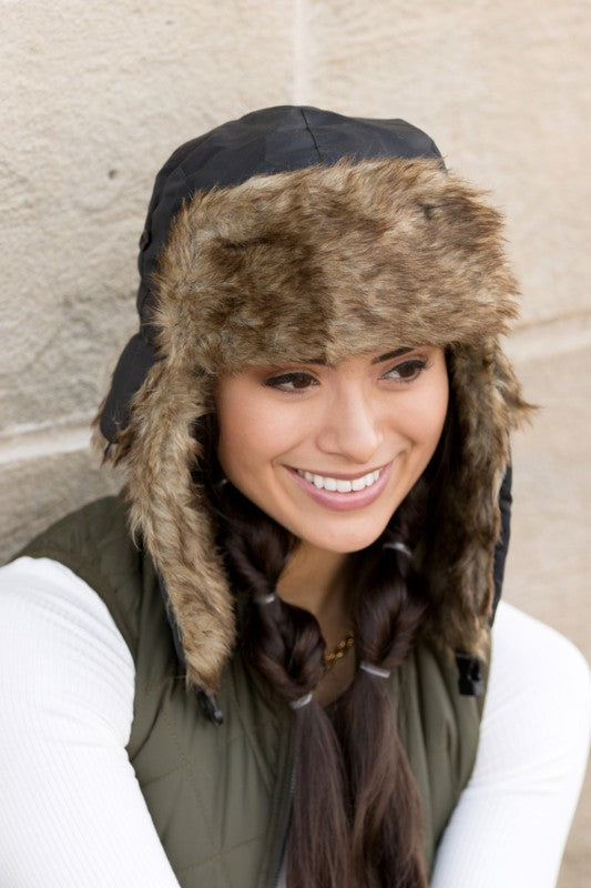 Model wearing Alpine Aviator Trapper Hat with faux fur lining and ear flaps, shown in multiple angles.