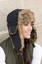 Model wearing Alpine Aviator Trapper Hat with faux fur lining and ear flaps, shown in multiple angles.