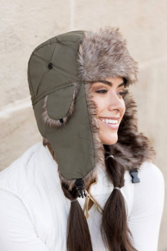 Model wearing Alpine Aviator Trapper Hat with faux fur lining and ear flaps, shown in multiple angles.