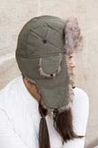 Model wearing Alpine Aviator Trapper Hat with faux fur lining and ear flaps, shown in multiple angles.