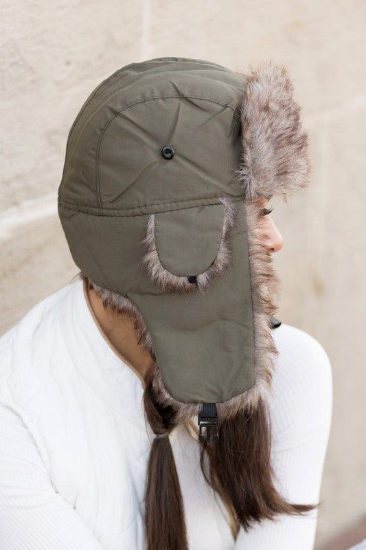 Model wearing Alpine Aviator Trapper Hat with faux fur lining and ear flaps, shown in multiple angles.