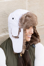 Model wearing Alpine Aviator Trapper Hat with faux fur lining and ear flaps, shown in multiple angles.