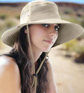 Person wearing  a men and women bucket hat with uv protection for hiking beach hats