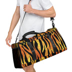 Man holding tiger-striped duffle bag with shoulder strap