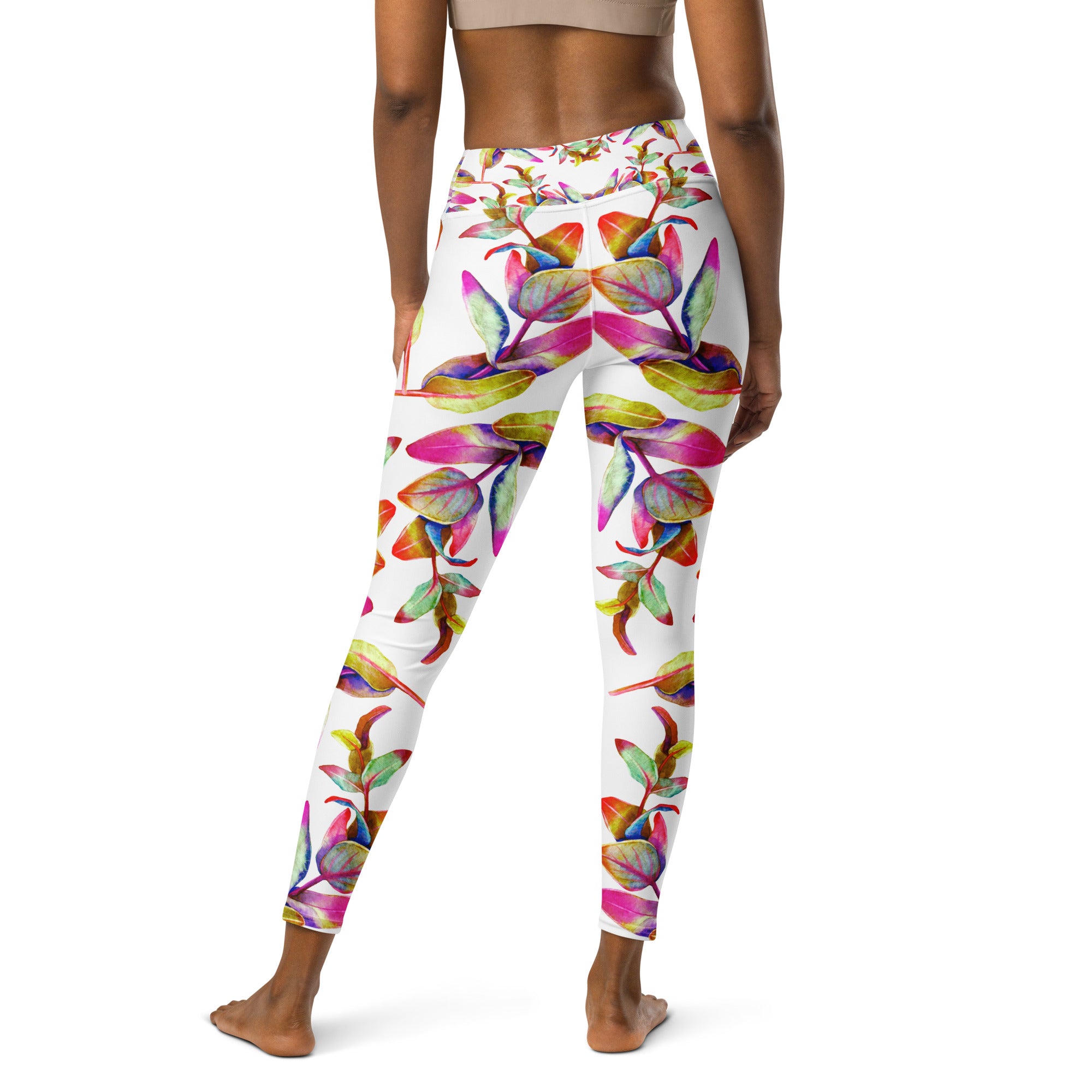Women's high-waist yoga leggings featuring a vibrant floral print on a white background. Soft, stretchy, and perfect for workouts, yoga, and activewear fashion