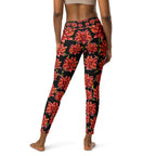Women's high-waist yoga leggings featuring a bold red floral print on a black background. Stylish, stretchy, and designed for yoga, workouts, and everyday activewear