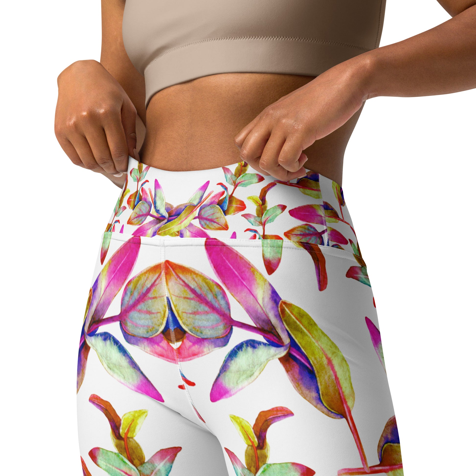 Women's high-waist yoga leggings featuring a vibrant floral print on a white background with enyohouse logo. Showing the inner pocket. Soft, stretchy, and perfect for workouts, yoga, and activewear fashion