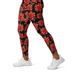 Women's high-waist yoga leggings featuring a bold red floral print on a black background. Stylish, stretchy, and designed for yoga, workouts, and everyday activewear