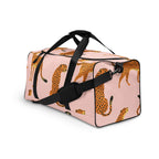 pink cheetah-print duffle bag with mesh side pocket and black straps